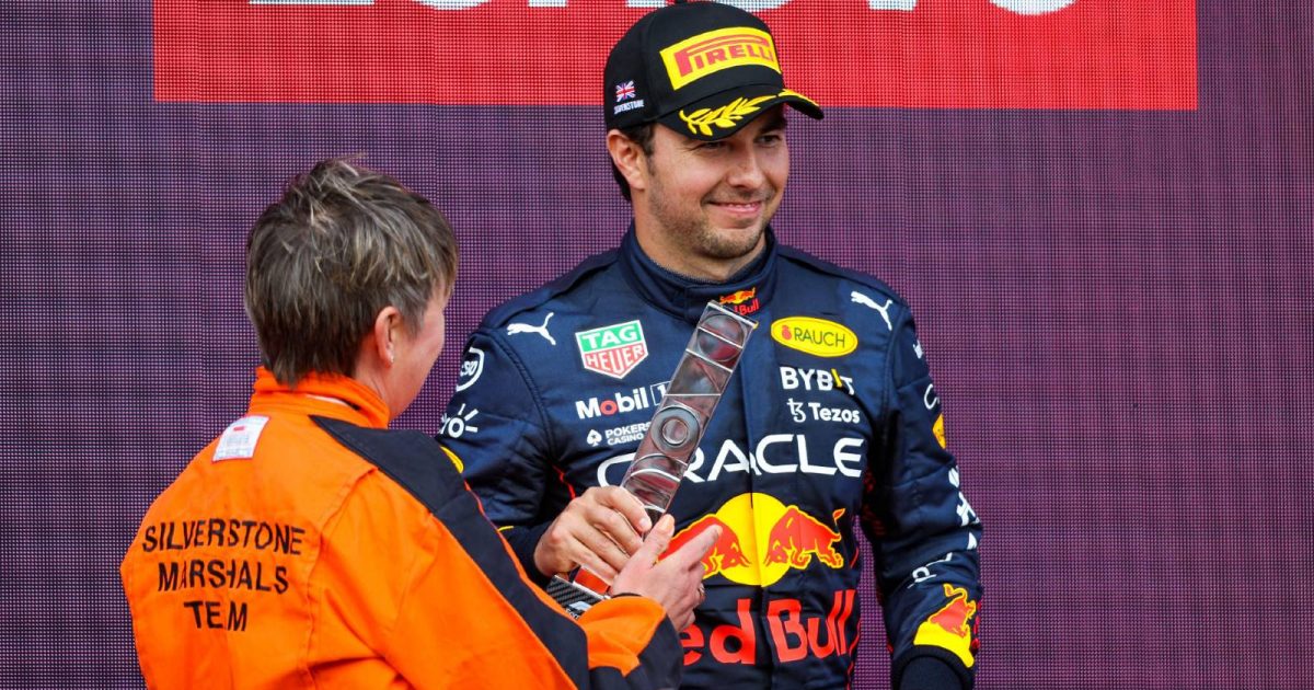 Sergio Perez receives his trophy after the British GP. Silverstone July 2022.