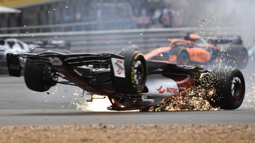 Zhou Guanyu's Alfa Romeo in a shower of sparks the car upside down. Silverstone July 2022