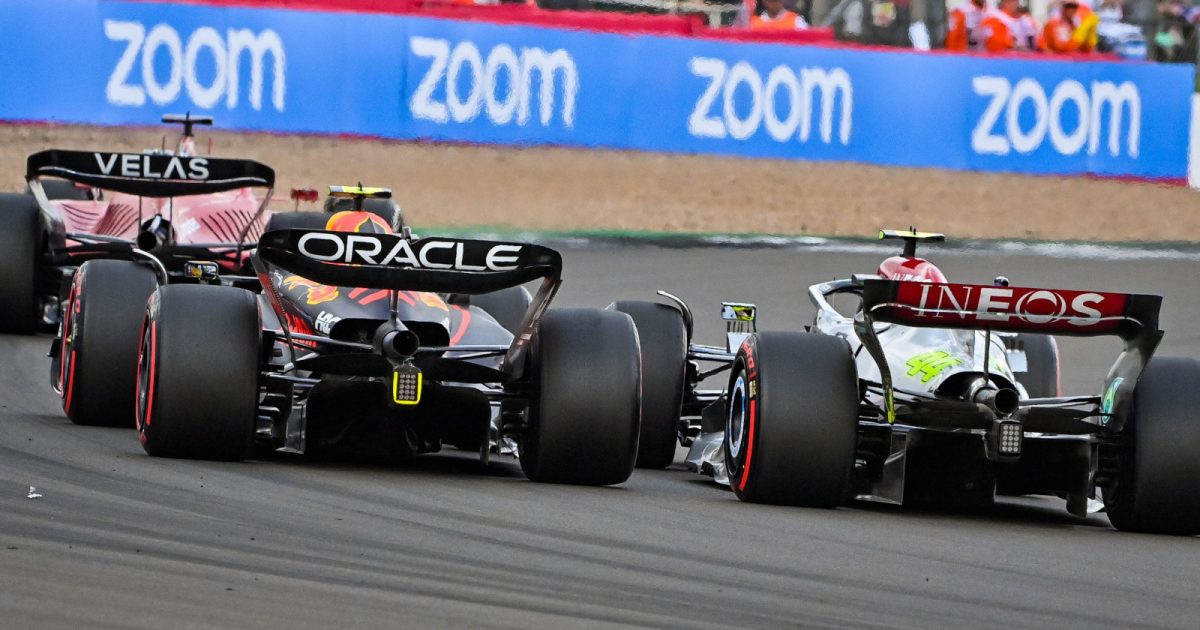 Charles Leclerc trying to defend against Sergio Perez and Lewis Hamilton. Silverstone July 2022