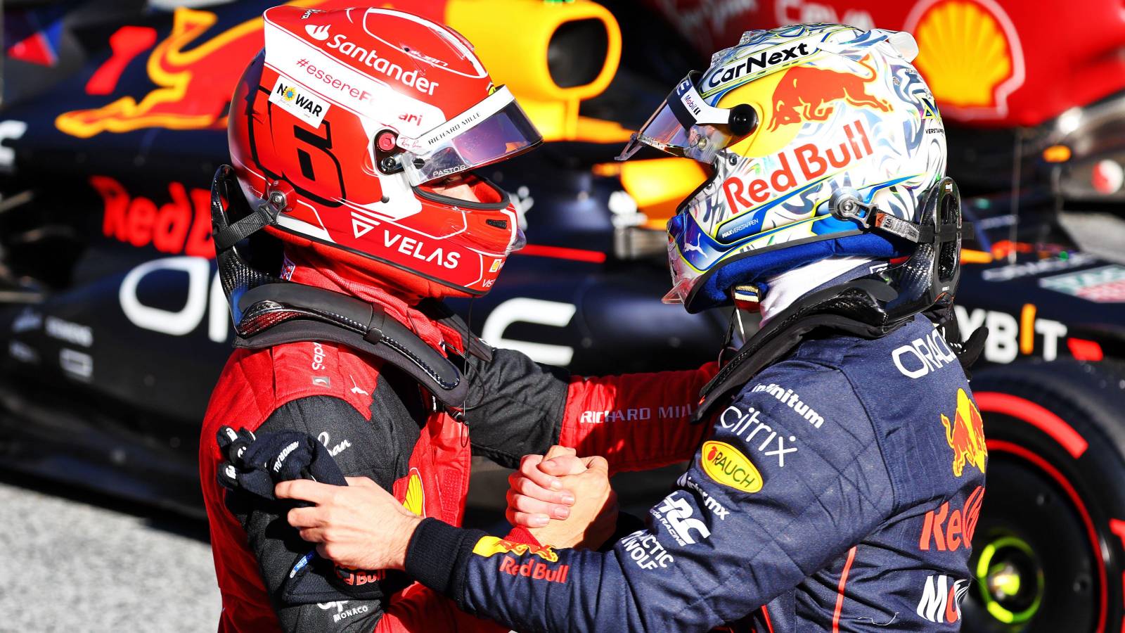 Charles Leclerc, Ferrari and Max Verstappen, Red Bull, shake hands. Austria, July 2022.