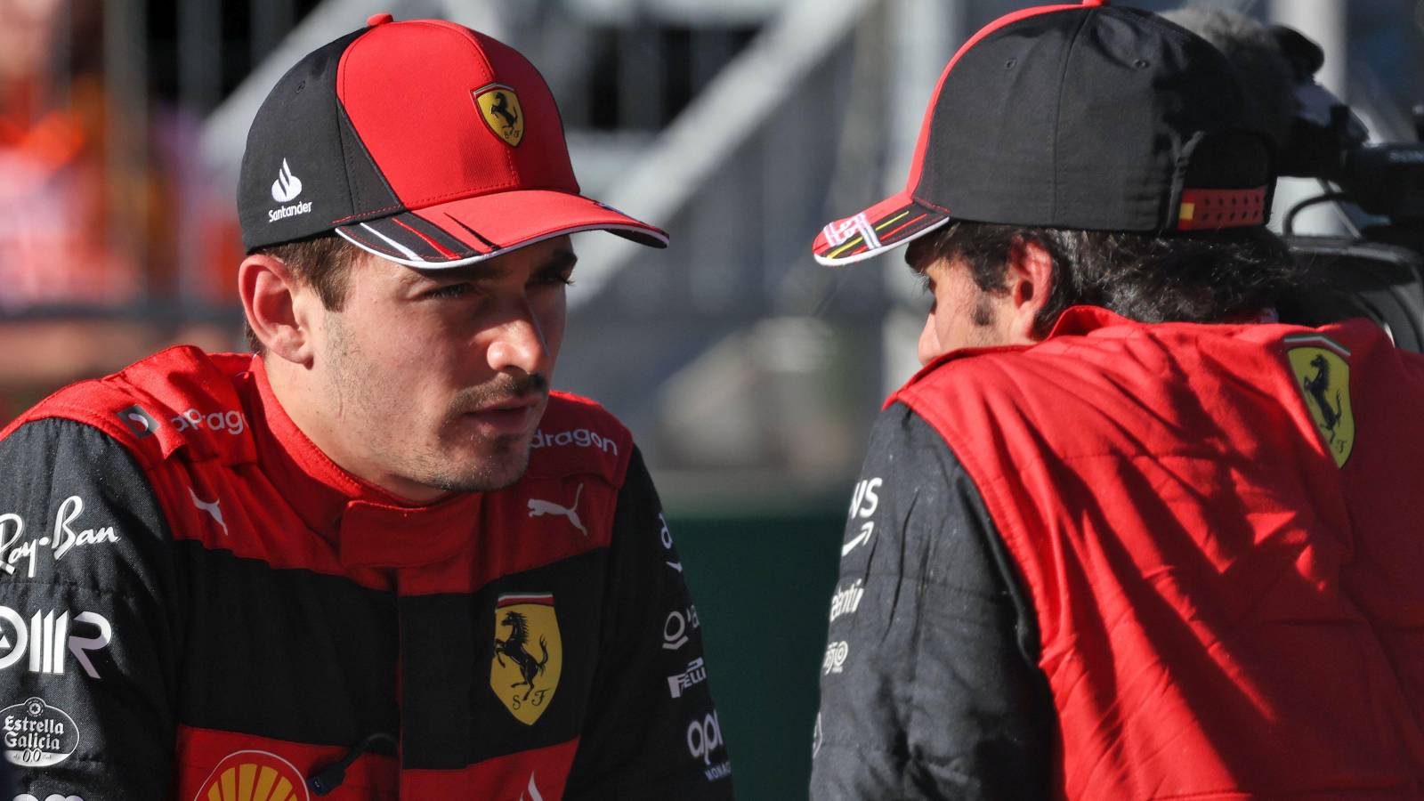 A staredown between Ferrari drivers Charles Leclerc and Carlos Sainz. Austria, July 2022.
