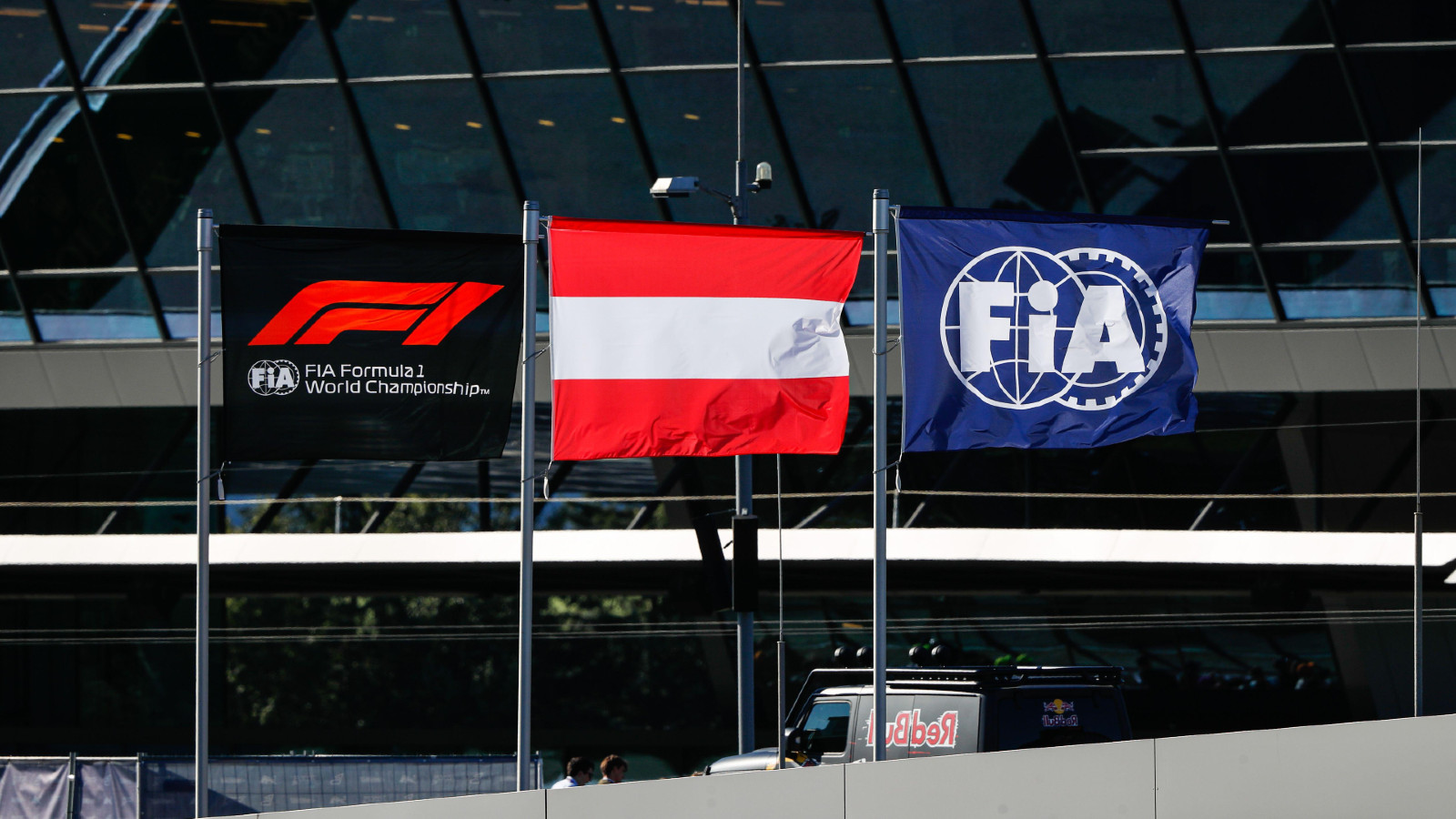FIA flags flying in the paddock at the Austrian Grand Prix. Spielberg, July 2022. summons