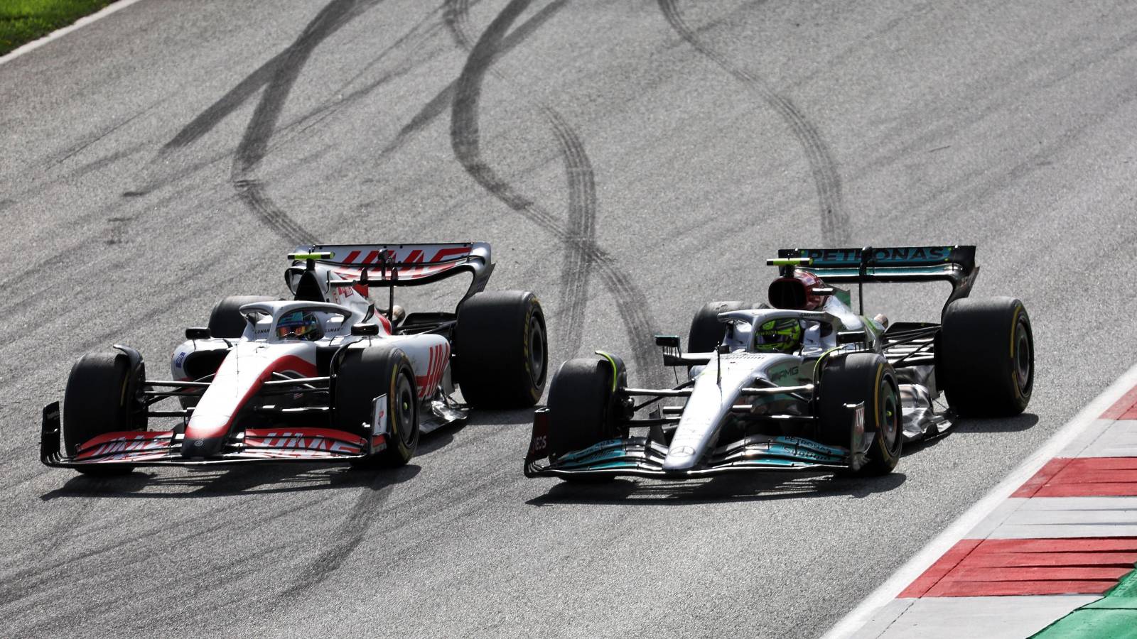 Lewis Hamilton, Mercedes, trying to pass Mick Schumacher, Haas. Austria, July 2022.