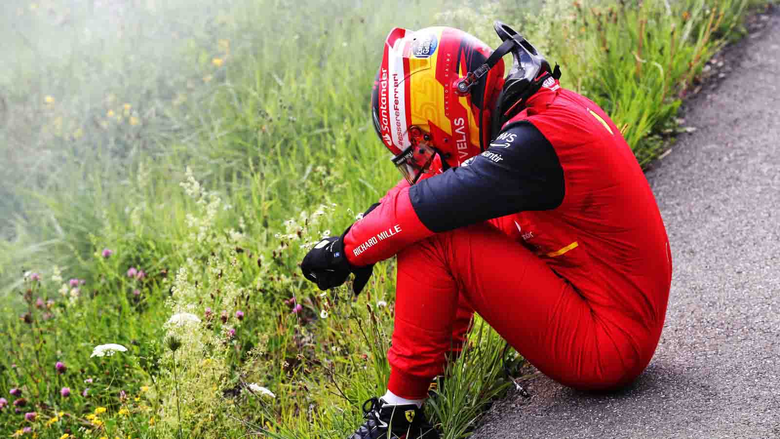 Carlos Sainz slumped over after retiring. Austria July 2022.