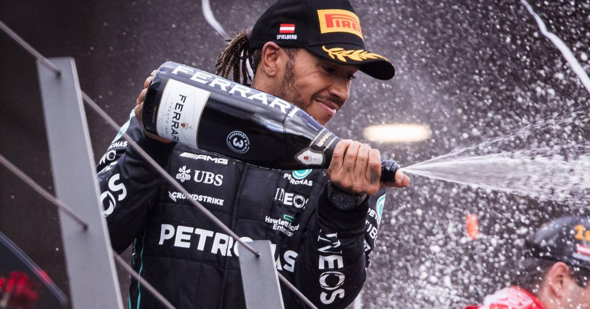 Lewis Hamilton, Mercedes, celebrates on the podium. Austria, July 2022.