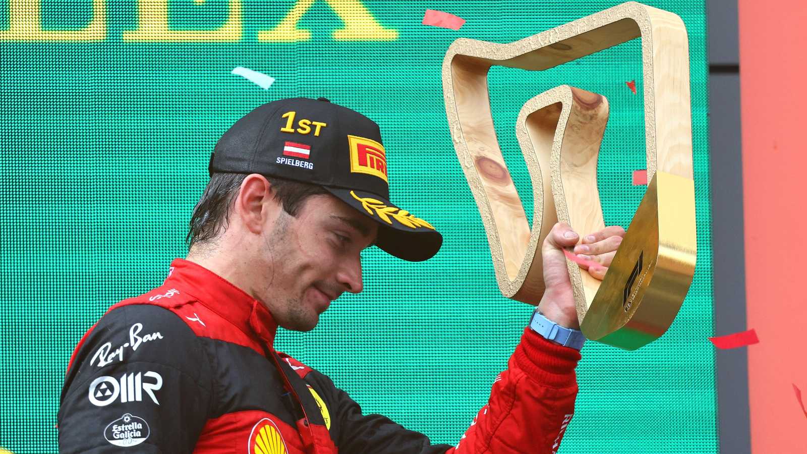 Charles Leclerc, Ferrari, holds up the winners trophy. Austria, July 2022.