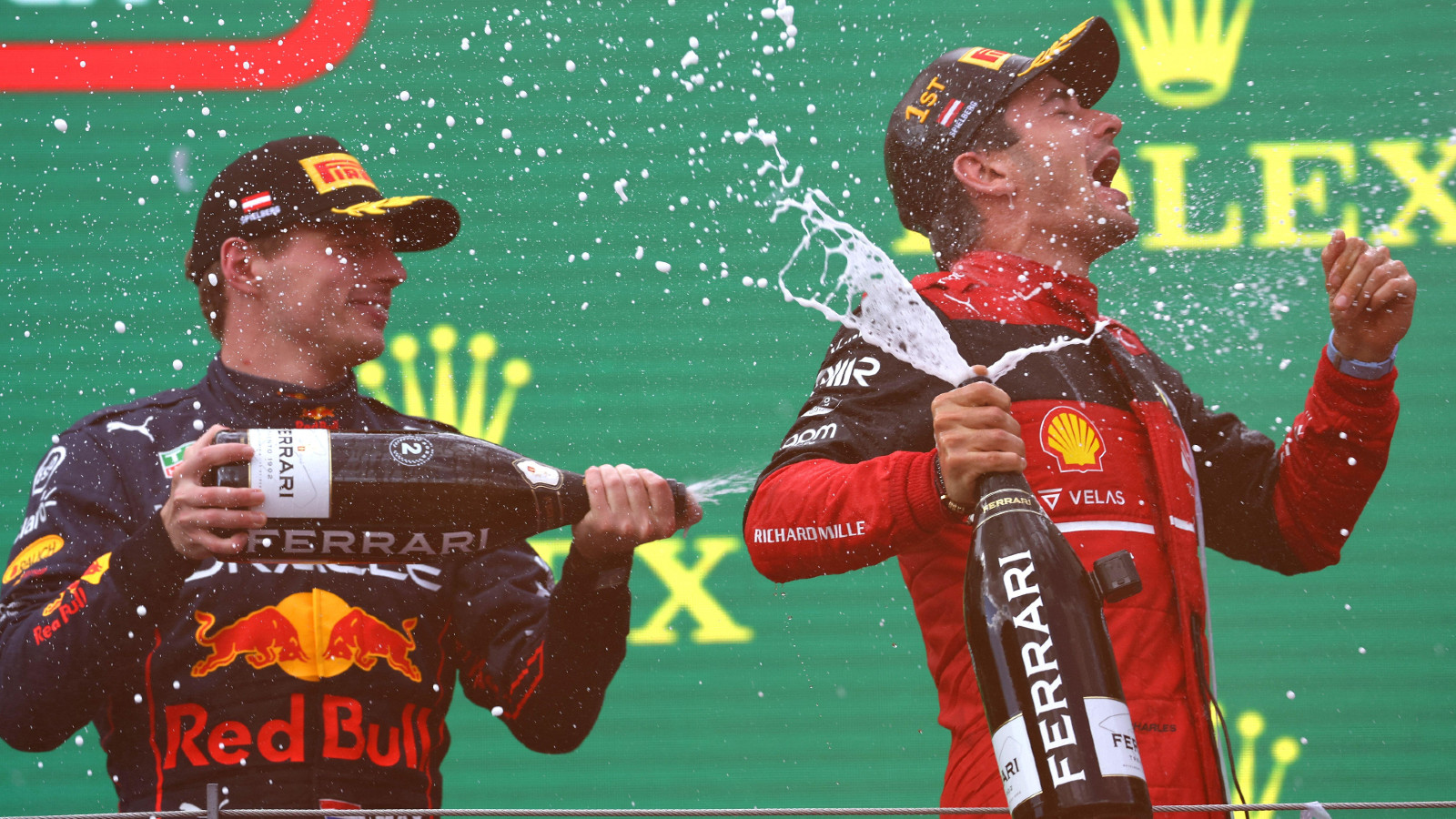 Red Bull's Max Verstappen and Ferrari's Charles Leclerc on the podium at the Austrian Grand Prix. Spielberg, July 2022.