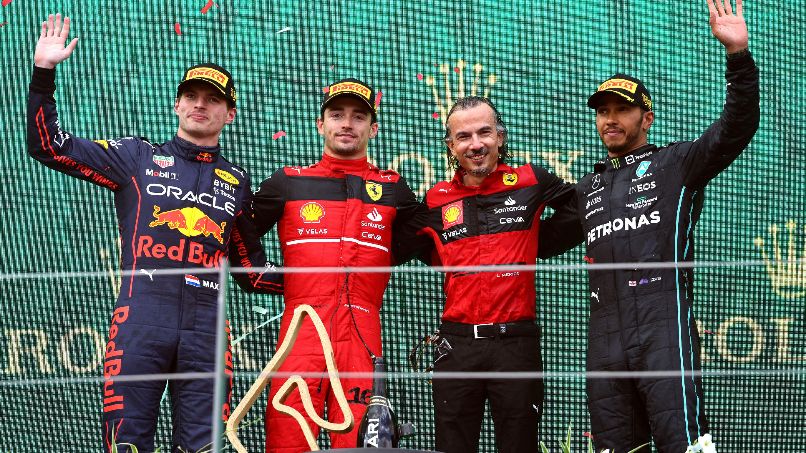 Ferrari's Charles Leclerc, Red Bull's Max Verstappen, and Mercedes' Lewis Hamilton on the podium at the Austrian Grand Prix. Spielberg, July 2022.