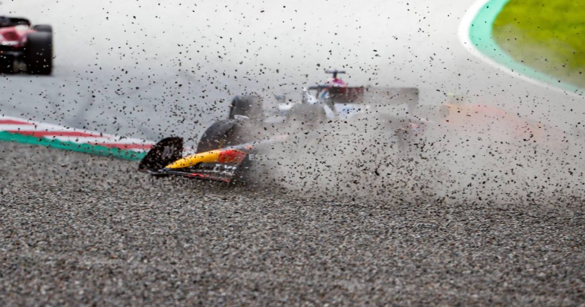 Sergio Perez, Red Bull, slides through the gravel after contact with George Russell, Mercedes. Austria, July 2022.