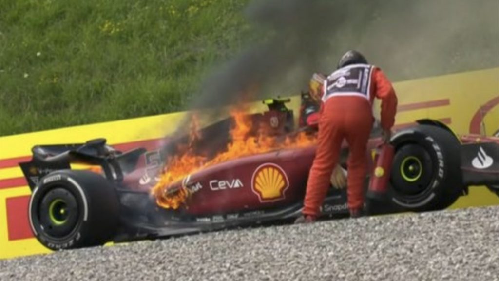 Carlos Sainz still in his Ferrari as the flames take hold. Austria July 2022