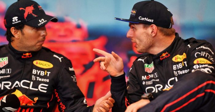 Max Verstappen pointing at Sergio Perez as he explains something. Monaco May 2022