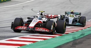 Mick Schumacher's Haas ahead of Lewis Hamilton's Mercedes. Red Bull Ring July 2022.