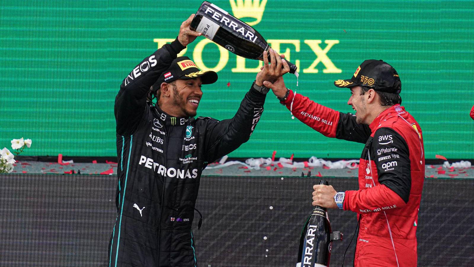 Lewis Hamilton pours bottle over Charles Leclerc. Red Bull Ring July 2022.