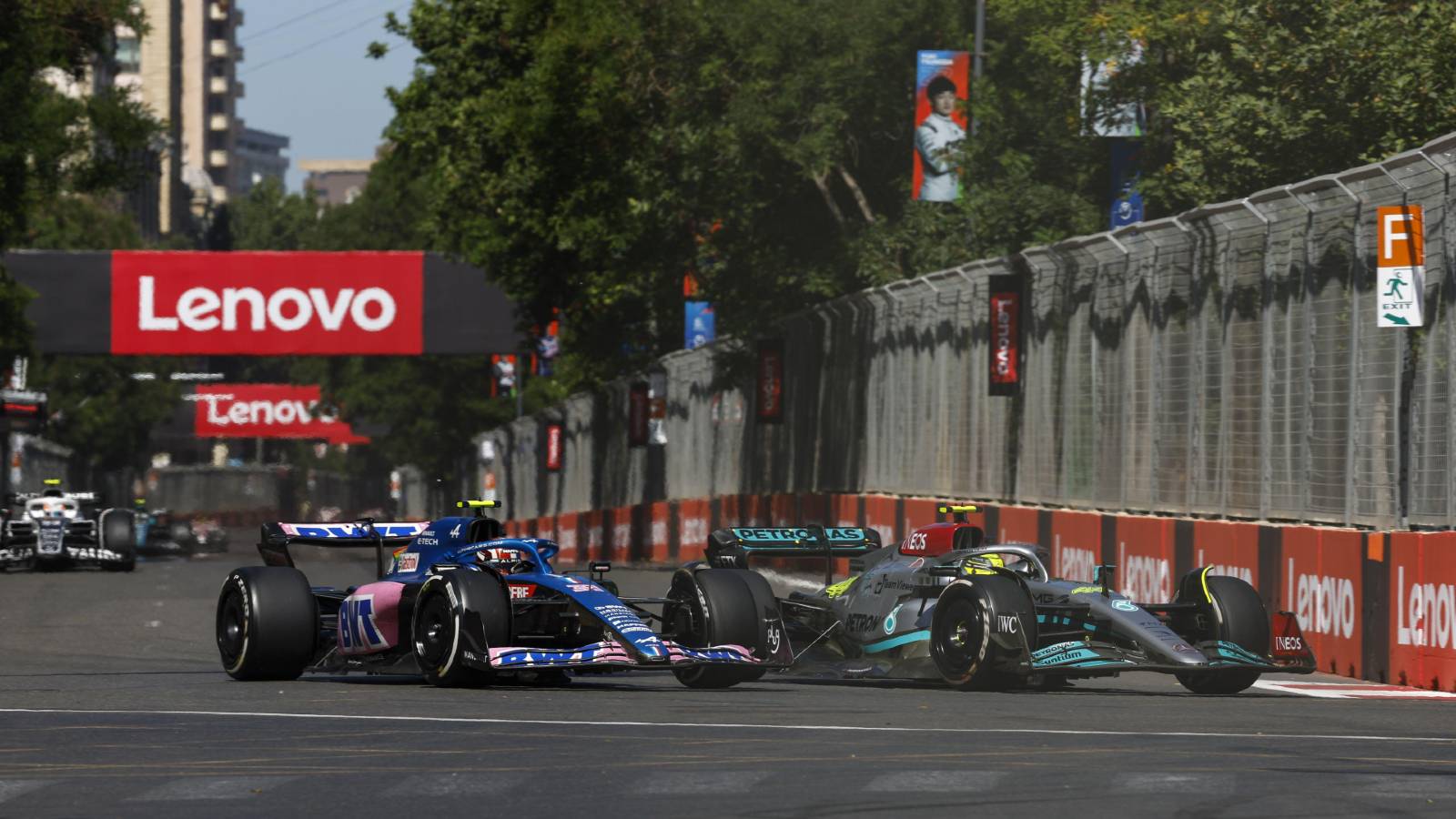 Esteban Ocon's Alpine alongside Lewis Hamilton's Mercedes. Baku June 2022.