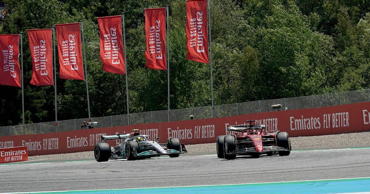 Lewis Hamilton's Mercedes follows Charles Leclerc's Ferrari. Red Bull Ring July 2022.