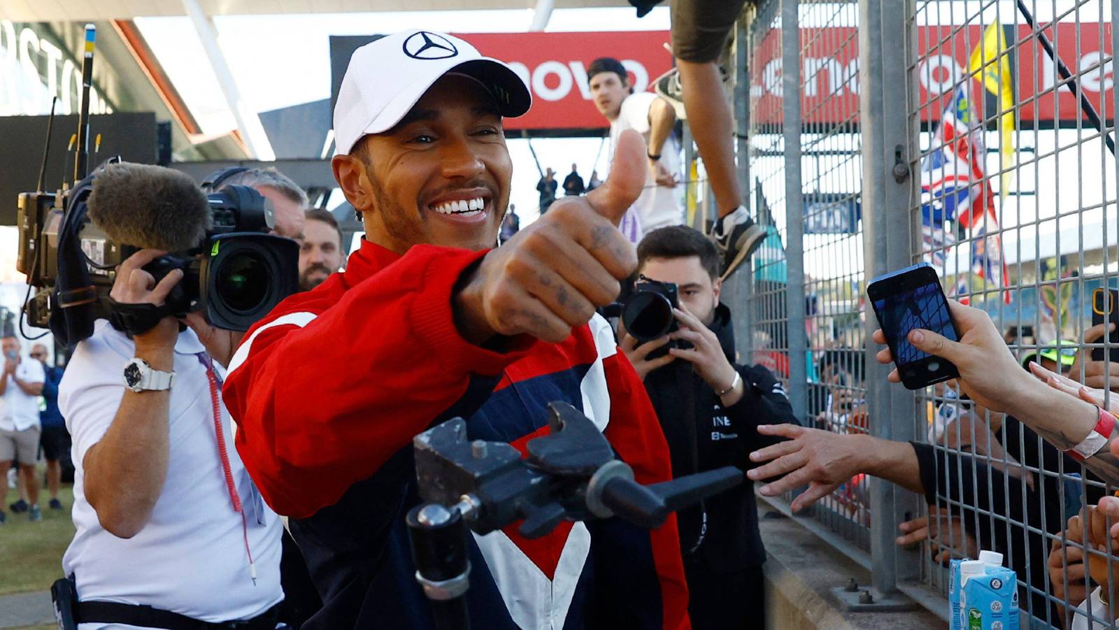 Lewis Hamilton gives a thumbs-up to the fans. Silverstone July 2022.