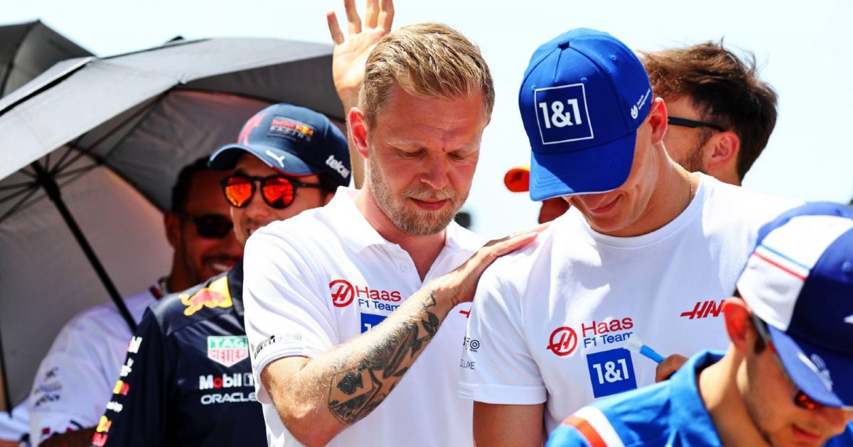 Kevin Magnussen with his hand on Mick Schumacher's shoulder. Barcelona May 2022.
