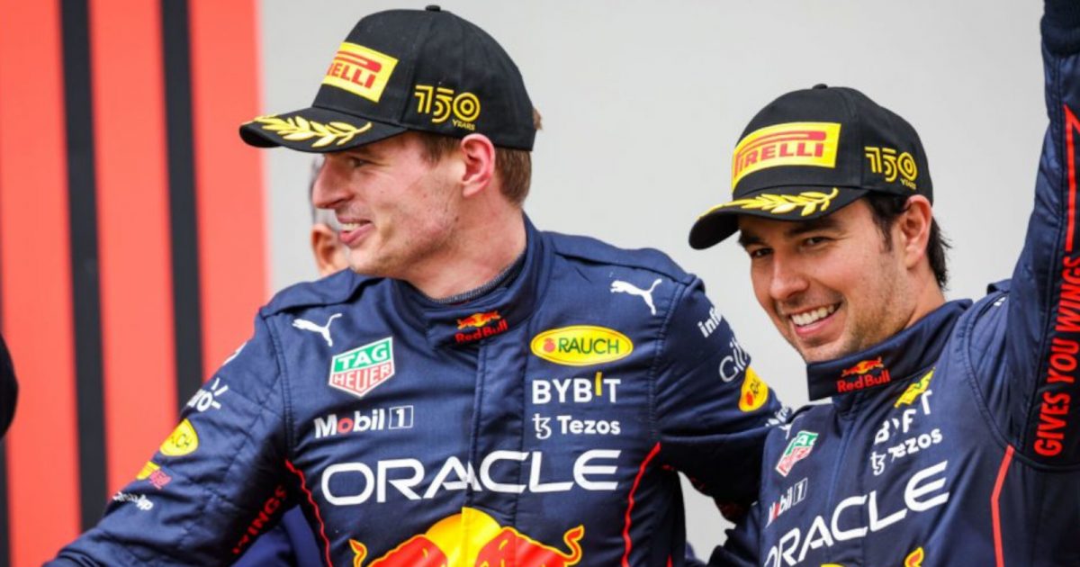 Max Verstappen and Sergio Perez smiling on the podium having finished 1-2. Imola April 2022