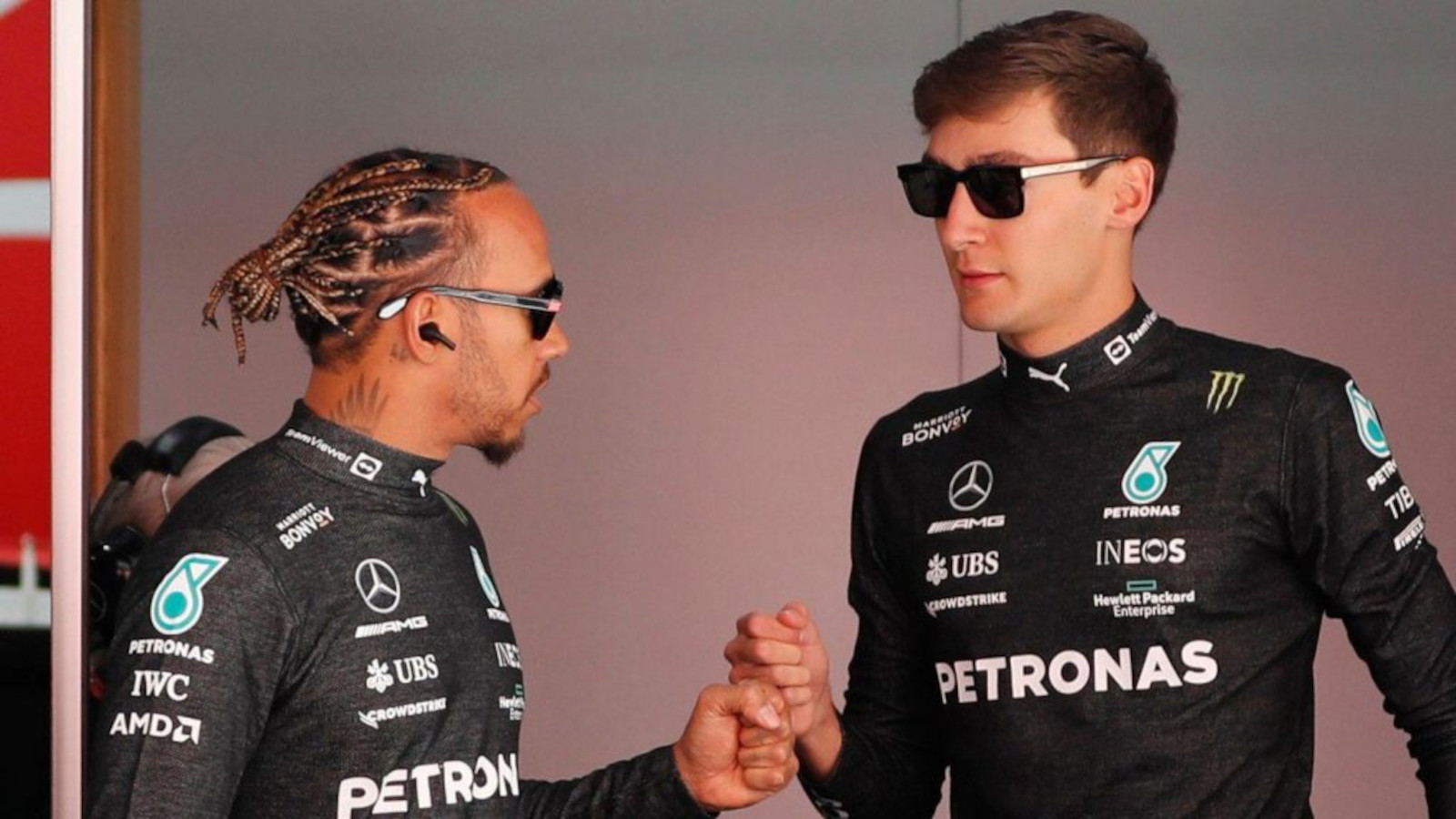 Fist bump between Lewis Hamilton and George Russell, Mercedes. Spain May 2022