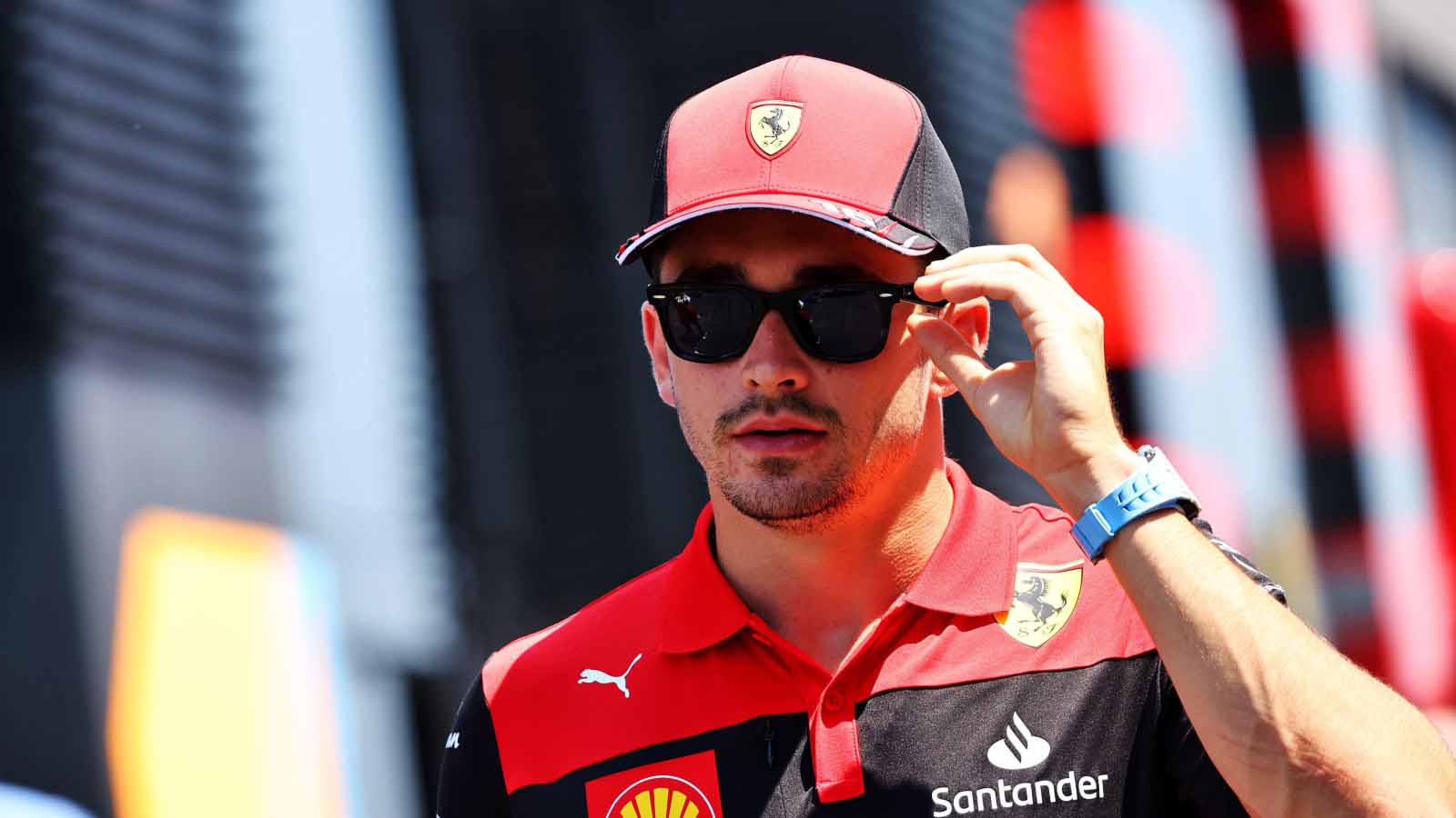 Charles Leclerc wears sunglasses in the paddock. France July 2022.