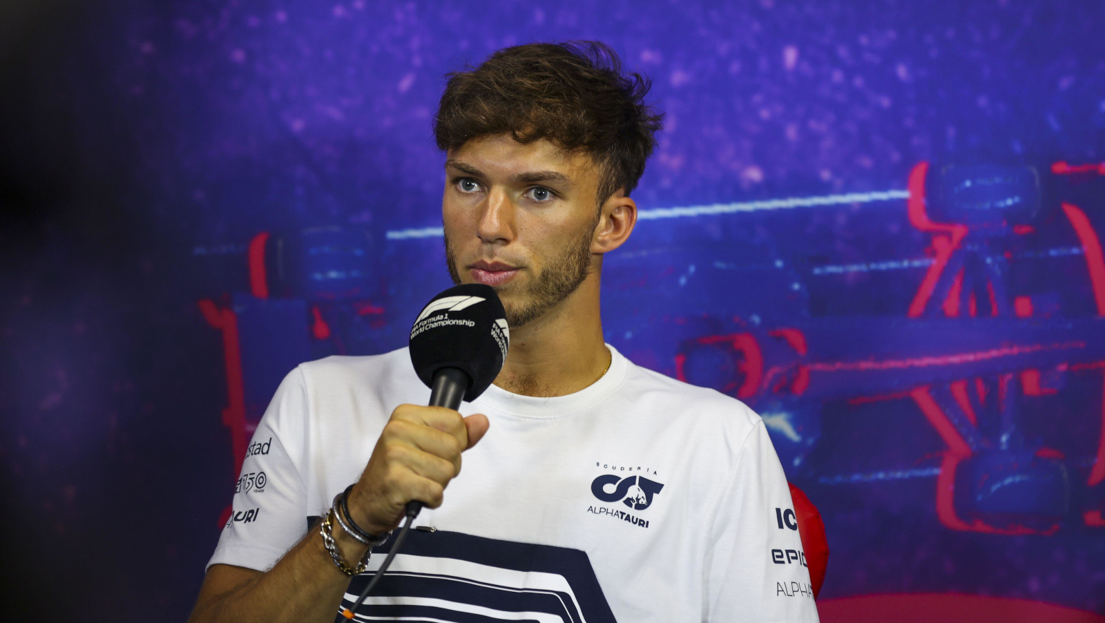 Pierre Gasly holding the microphone during a press conference. France July 2022