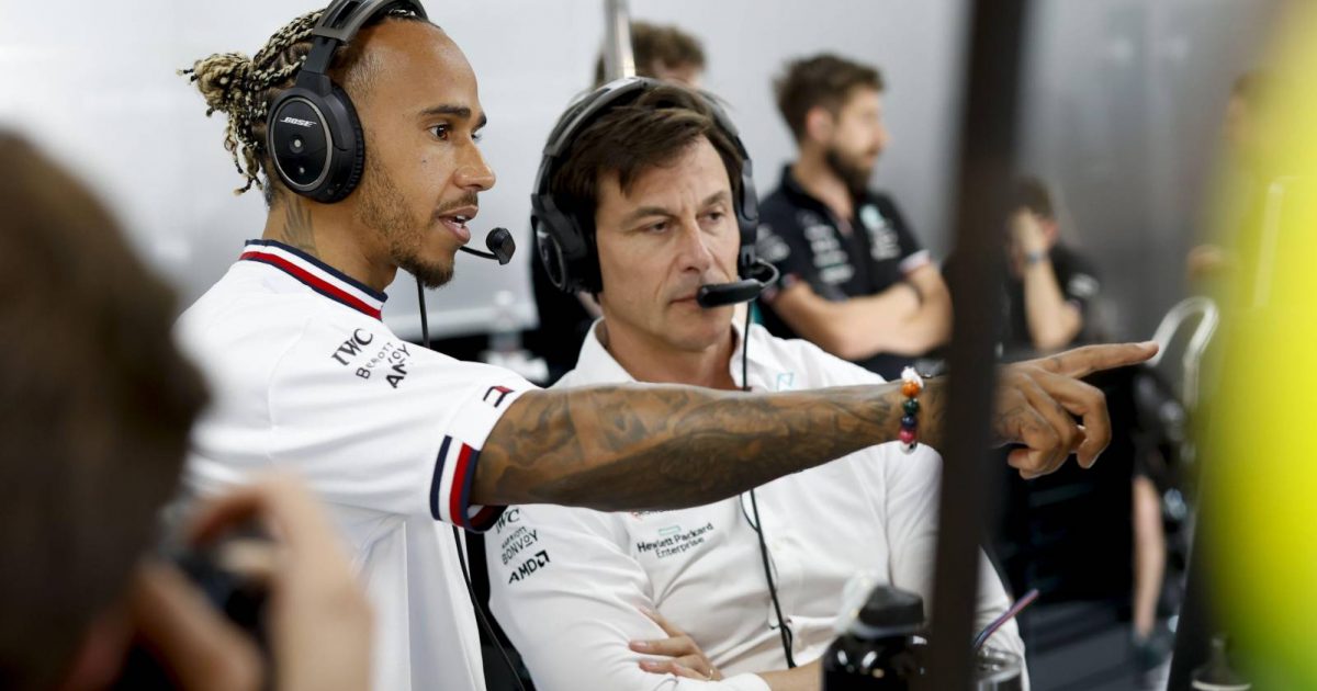 Lewis Hamilton pointing at a screen next to Toto Wolff. Paul Ricard July 2022.