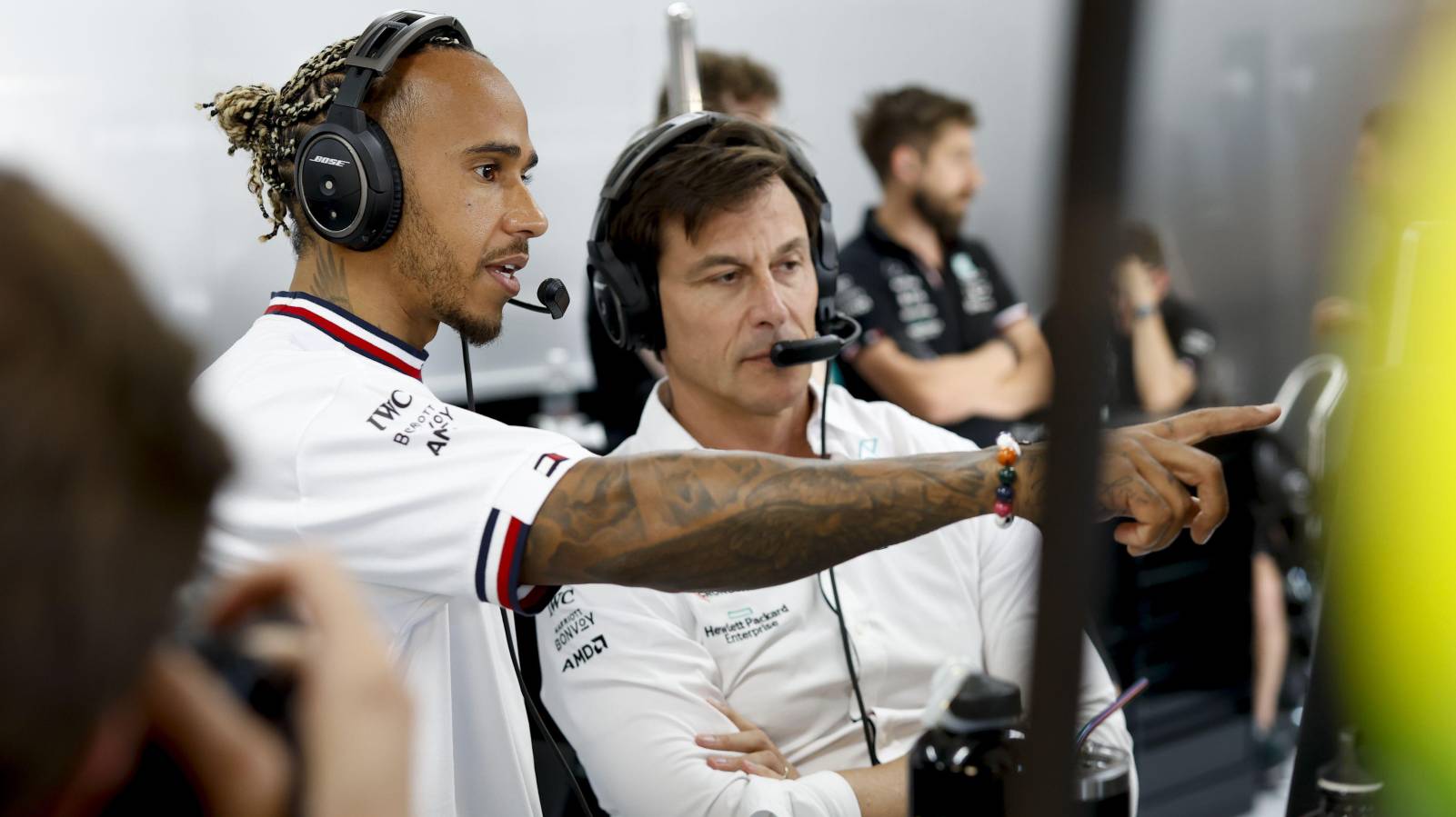 Lewis Hamilton pointing at a screen next to Toto Wolff. Paul Ricard July 2022.