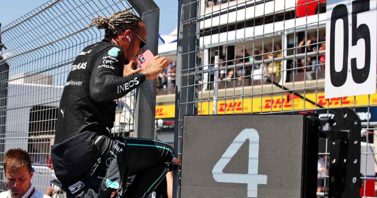 Lewis Hamilton jumps the pit wall. France July 2022.