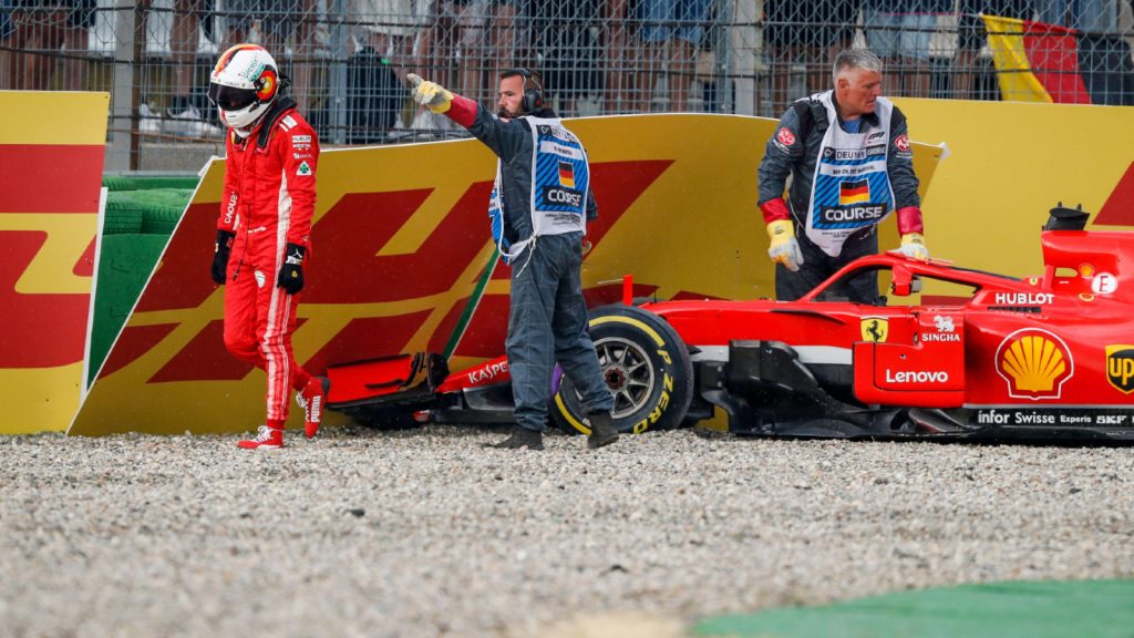 Ferrari's Sebastian Vettel trudges away after crashing out of the 2018 German Grand Prix. Hockenheim, July 2018.