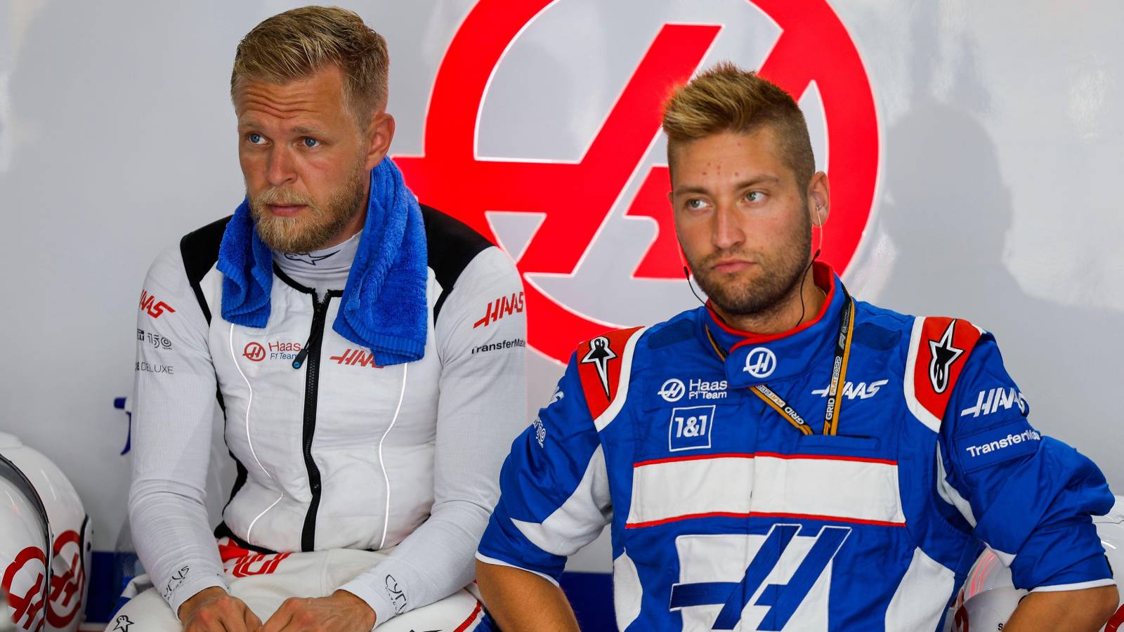Kevin Magnussen sits with a Haas colleague. Paul Ricard July 2022.