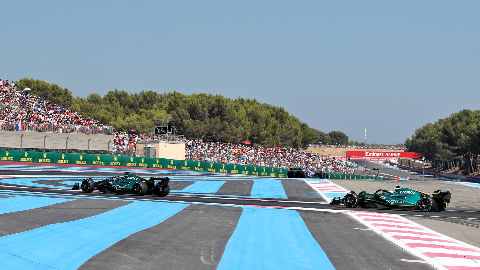 Sebastian Vettel behind Aston Martin team-mate Lance Stroll. France, July 2022.
