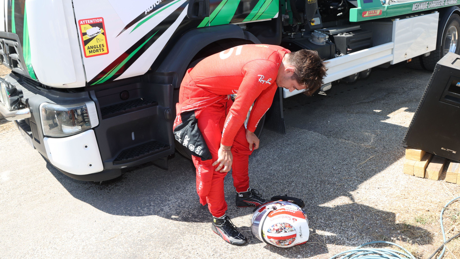 Charles Leclerc has his hands on his knees after his crash. France July 2022