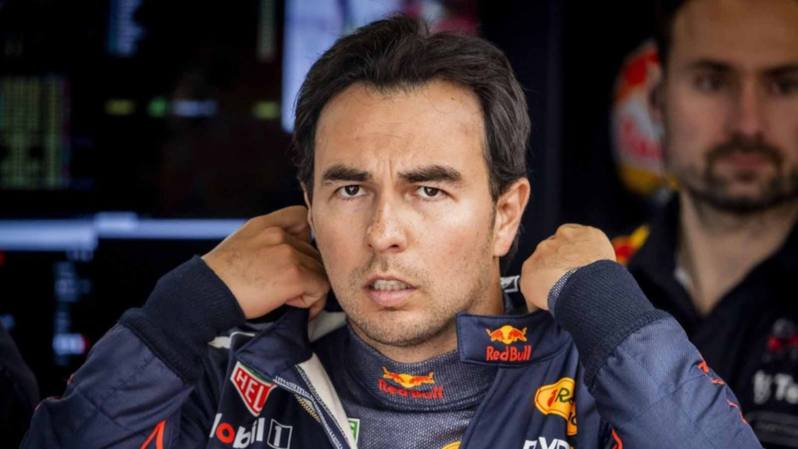 Sergio Perez looking focused as he prepares for a session. Silverstone July 2022.