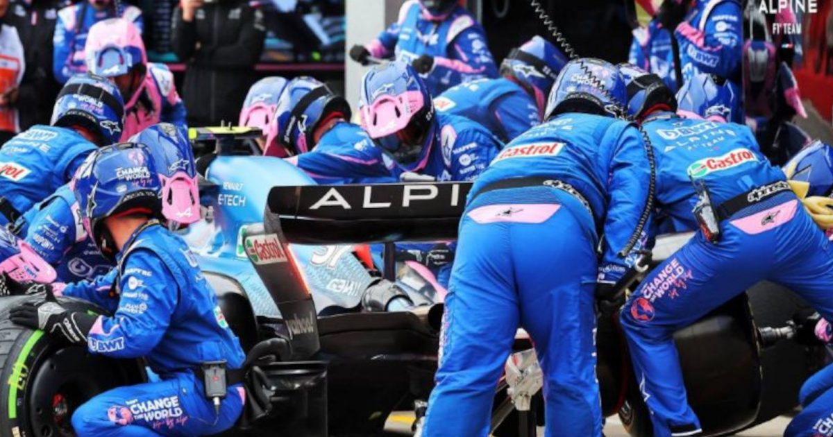 Esteban Ocon surrounded by his mechanics as he makes a pit stop. Imola April 2022