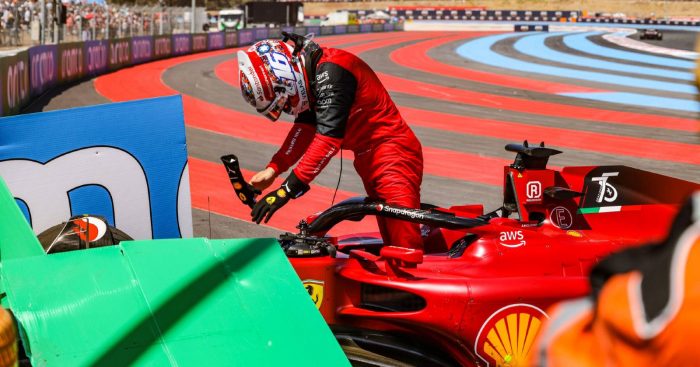 Charles Leclerc removes the steering wheel from his Ferrari after crashing. Paul Ricard July 2022.