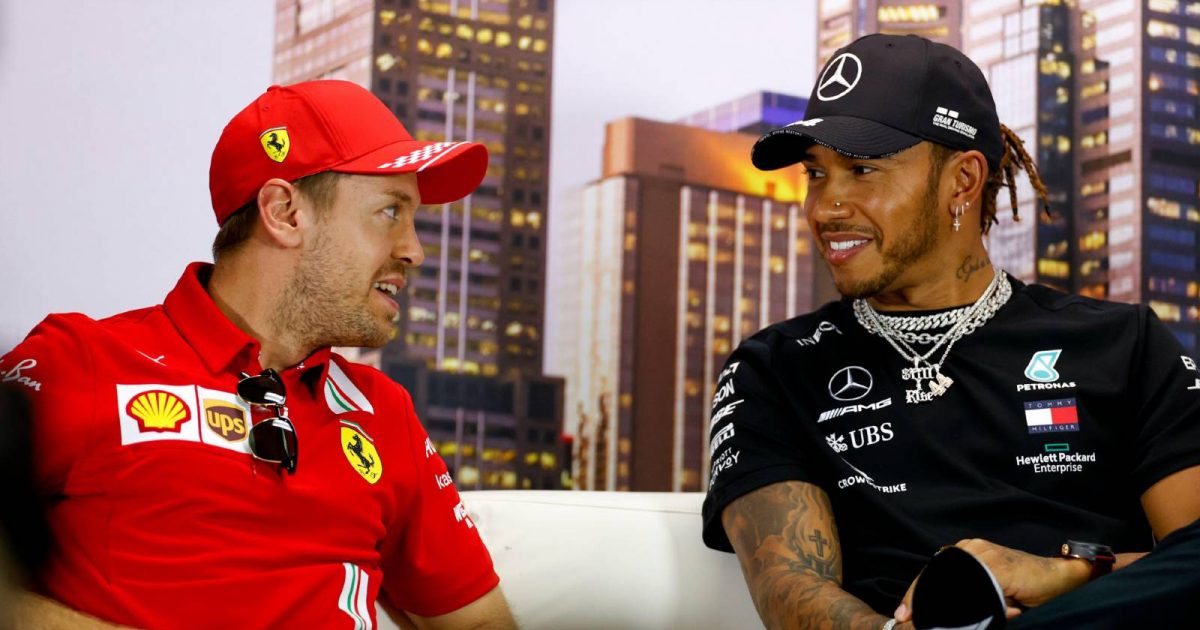 Sebastian Vettel and Lewis Hamilton smile at each other. Melbourne March 2020.