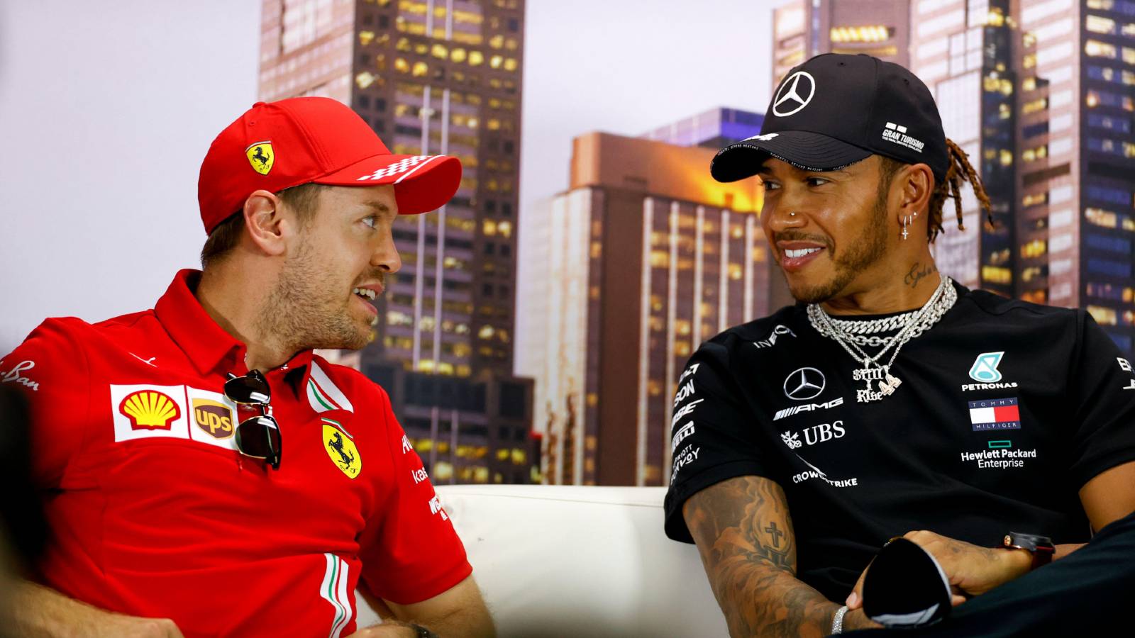 Sebastian Vettel and Lewis Hamilton smile at each other. Melbourne March 2020.