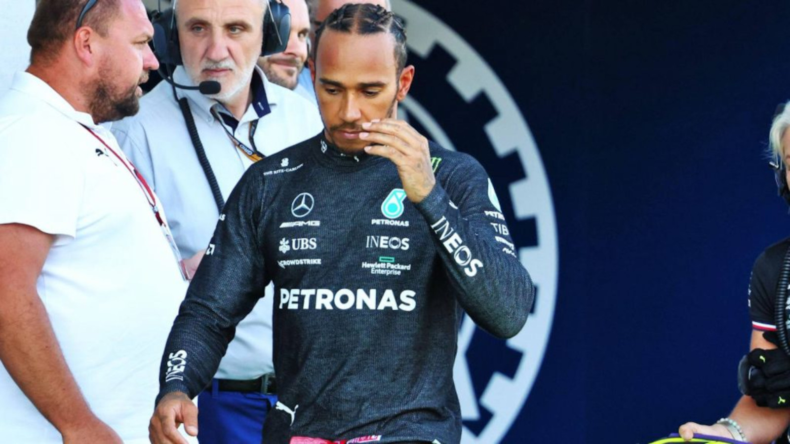 Lewis Hamilton looking serious as he walks. Austria July 2022
