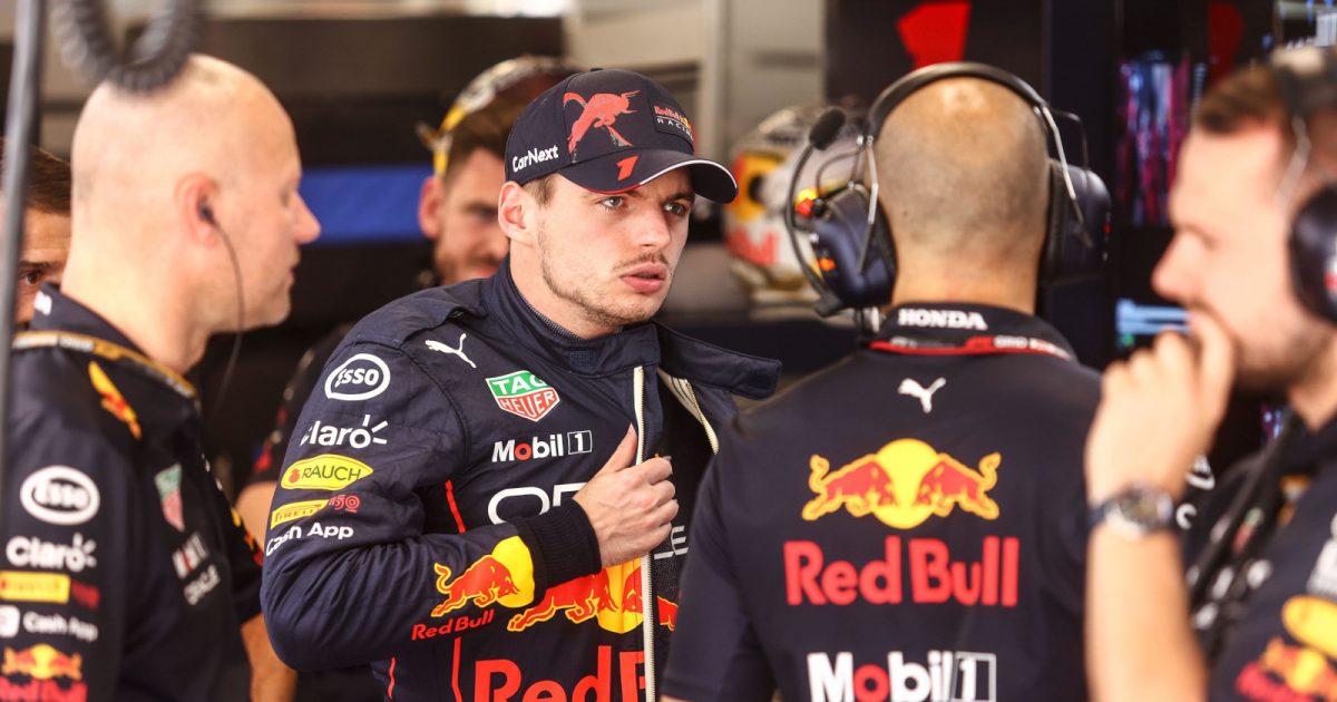 Max Verstappen speaking with his engineers, looks shocked. Hungary July 2022