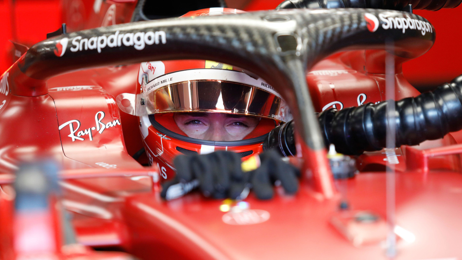 Charles Leclerc with smiling eyes sitting in his F1-75. Hungary July 2022