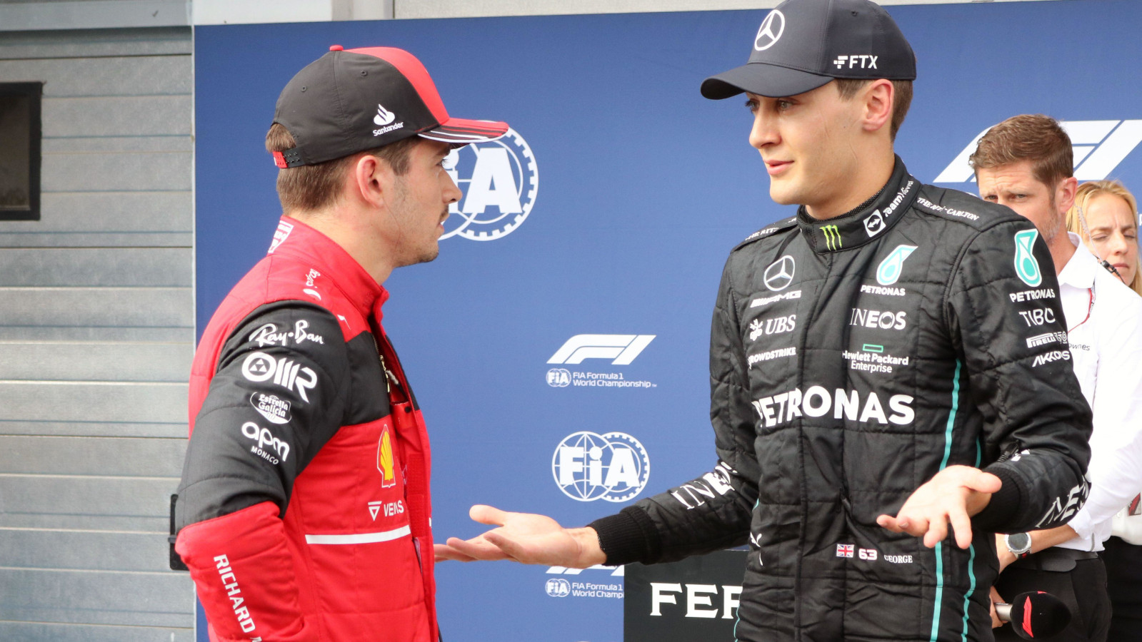 George Russell speaking with Charles Leclerc in parc ferme. Hungary July 2022