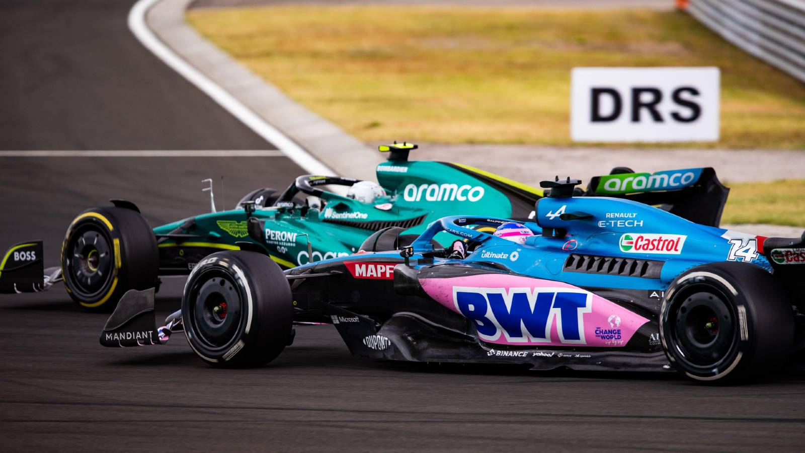 Sebastian Vettel, Aston Martin, ahead of Fernando Alonso, Alpine. Hungary, July 2022.