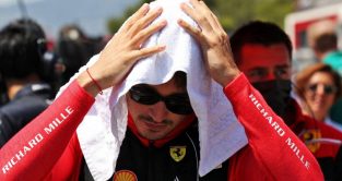 Ferrari driver Charles Leclerc with his head under a towel. France July 2022