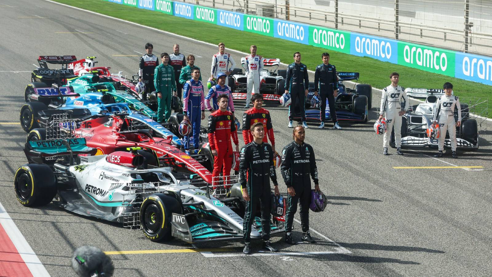 F1 drivers line up next to their cars. Bahrain March 2022.