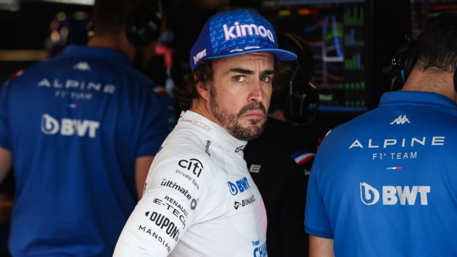 Fernando Alonso with his hands on his hips looking very serious. Canada June 2022