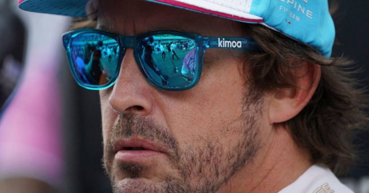 Fernando Alonso up close wearing sunglasses, grid action reflected. Miami May 2022