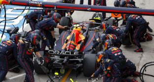 Sergio Perez makes a pit stop, surrounded by Red Bull Racing mechanics. Hungary July 2022
