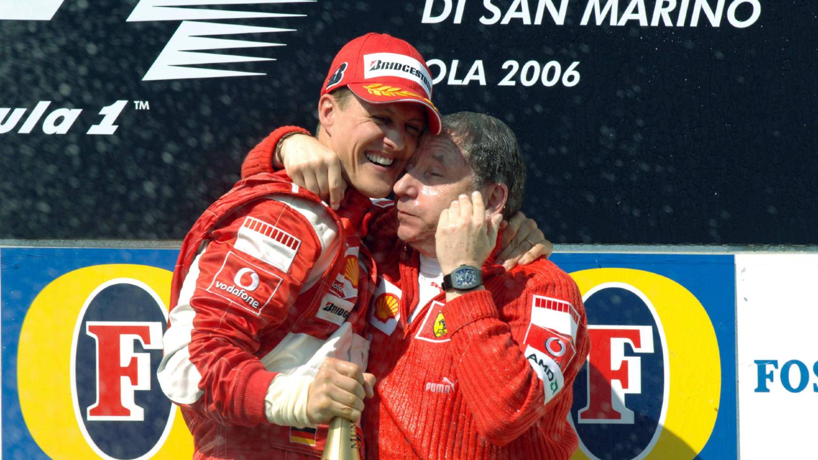 Michael Schumacher hugs Jean Todt. F1 Imola April 2006.