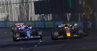Max Verstappen's Red Bull just ahead of Fernando Alonso's Alpine. Melbourne April 2022.