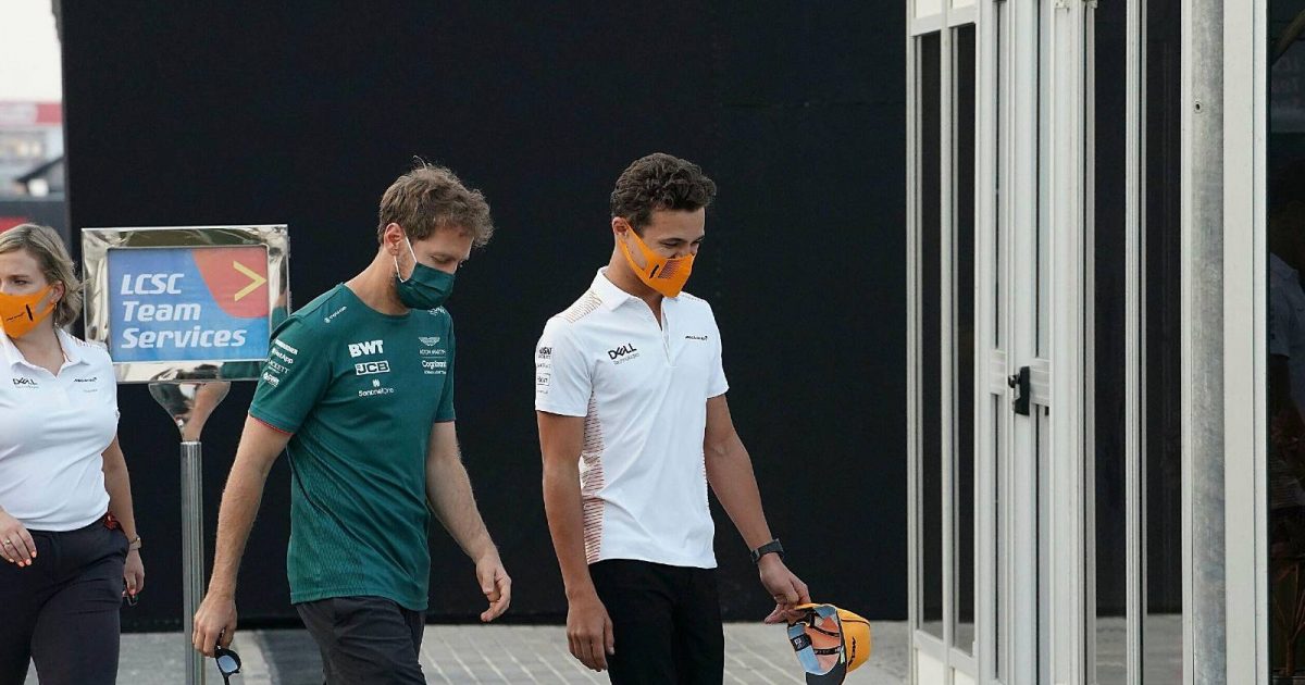 Sebastian Vettel, Aston Martin and Lando Norris, McLaren, walk together. Qatar, November 2021.
